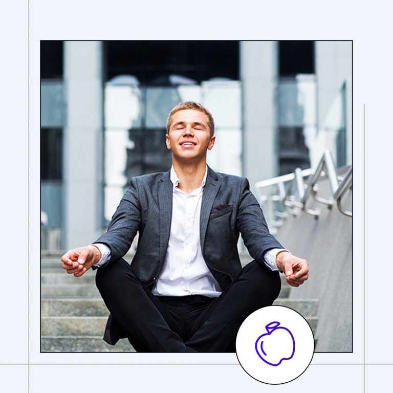 man sitting in meditative pose