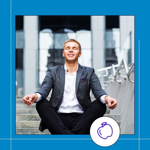 man sitting in meditative pose