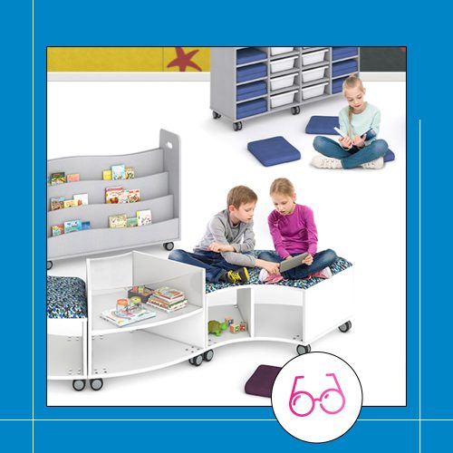 classroom setting with multiple children including mobile bookshelves and a curved lounge setting