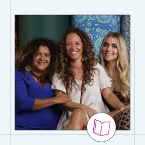 merryn apma with two other woman in her family sitting in front of bfx ottomans covered in her artwork that is part of the ninderry range