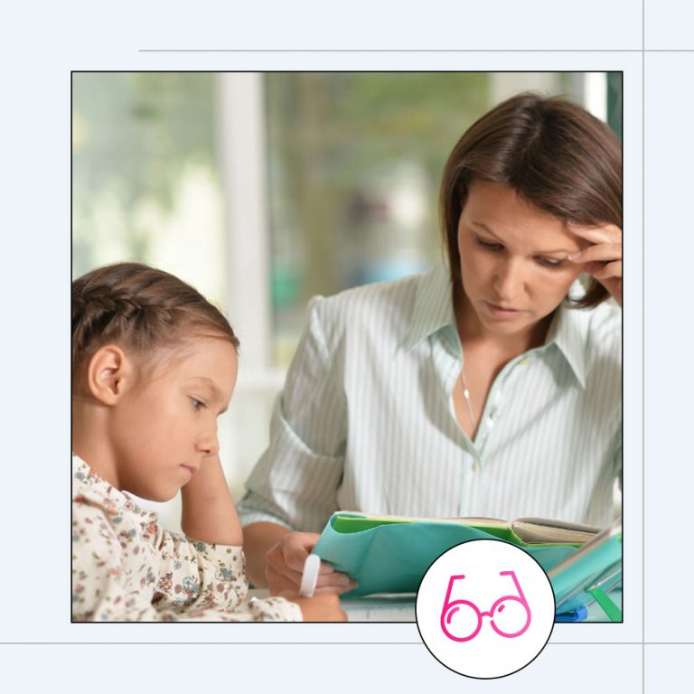 parents sitting with children doing school work